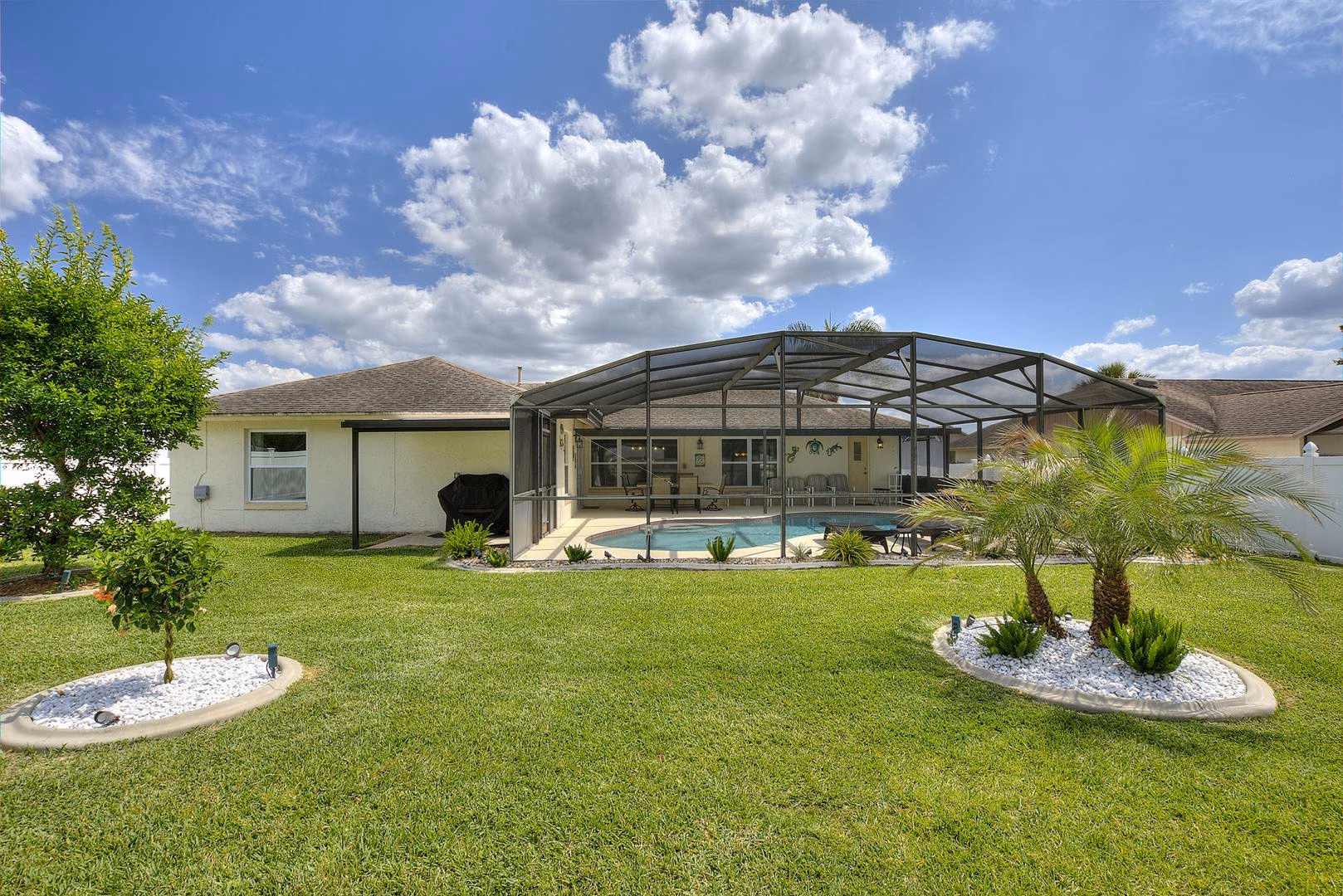 Back garden with pool enclosure