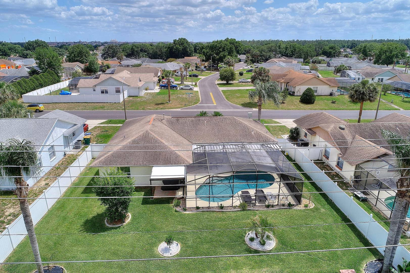 Aerial view of pool and fenced garden