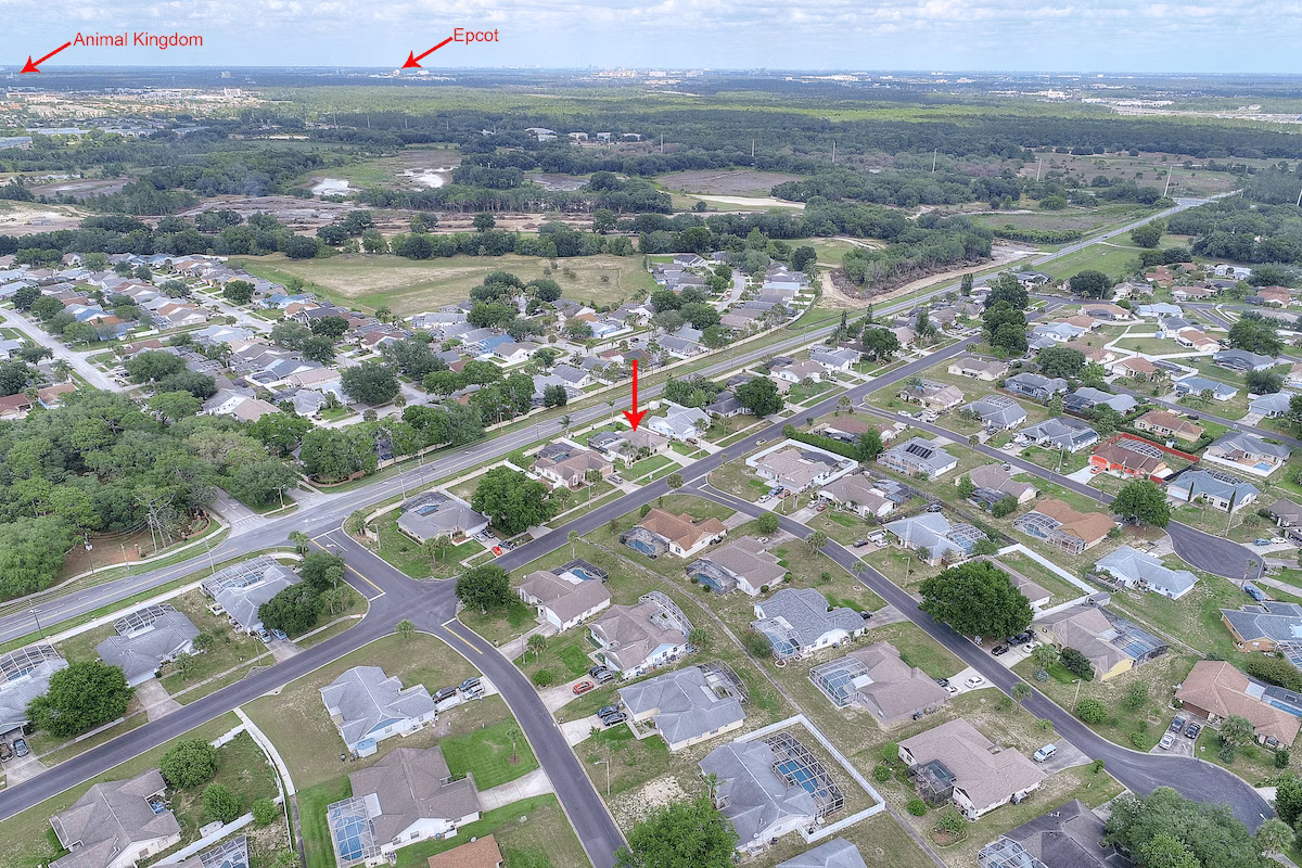 Aerial view of The Indian Retreat villa (red arrow) on Indian Ridge, Kissimmee, with Animal Kingdom and Epcot in the distance